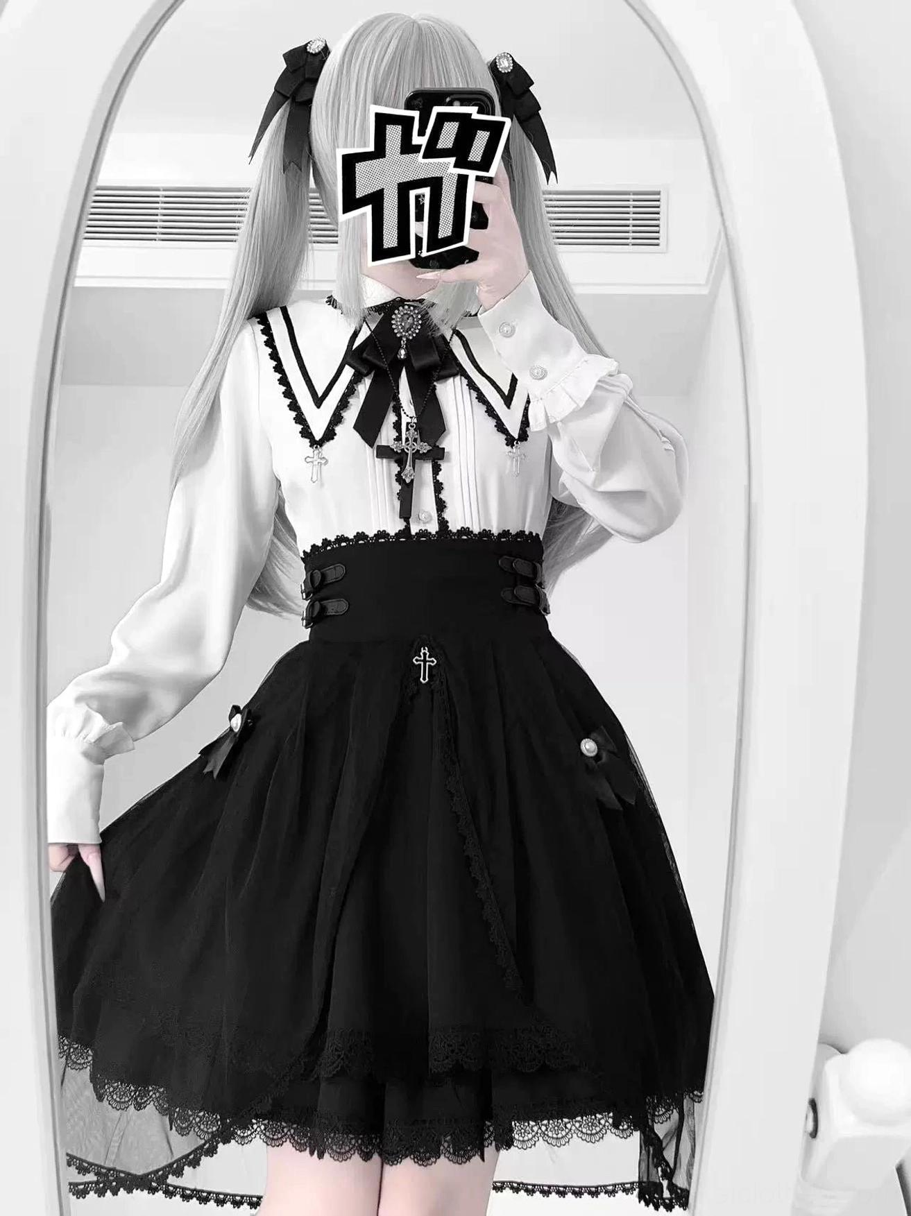 Side profile close-up detail view of Jirai Kei high-waist black skirt showcasing lace-up back corset detailing, functional buckle straps, and tulle overlay hem with crisp architectural silhouette
