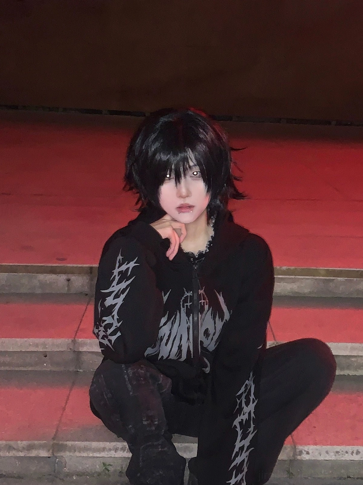 Jirai Kei black hoodie back view showing demon print design and sleeve graphics, full length display of gothic punk unisex sweatshirt construction