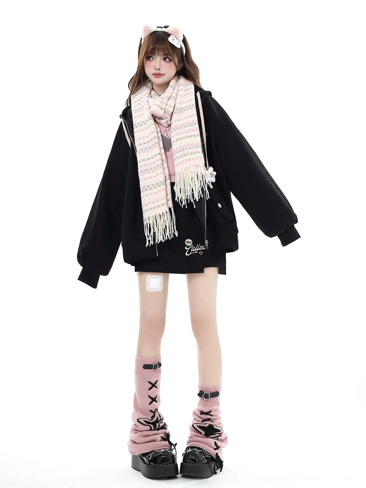 Black Jirai Kei hoodie zip-up jacket with printed leg warmers and band-aid aesthetic leg decoration, full-body front standing view