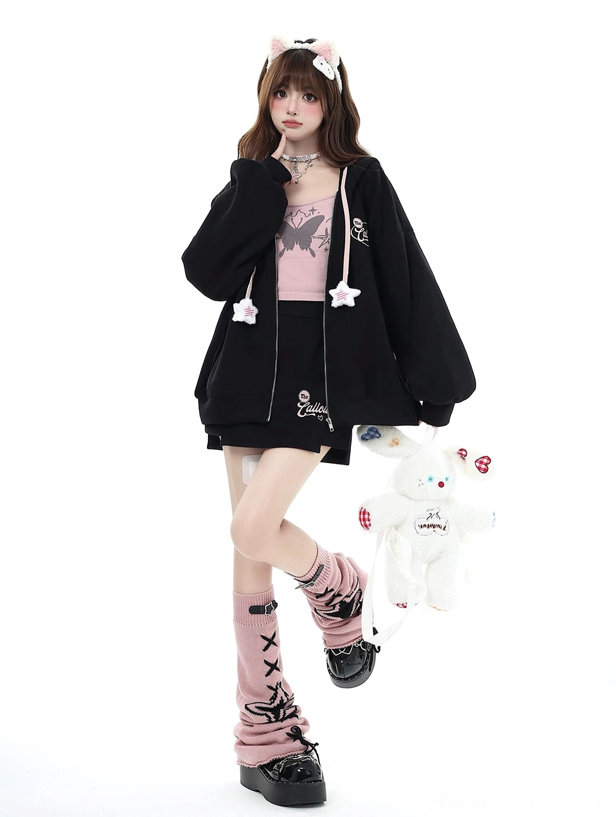 Black Jirai Kei zip-up hoodie and skirt set with printed leg warmers, butterfly camisole, and star drawstring, front view one leg raised