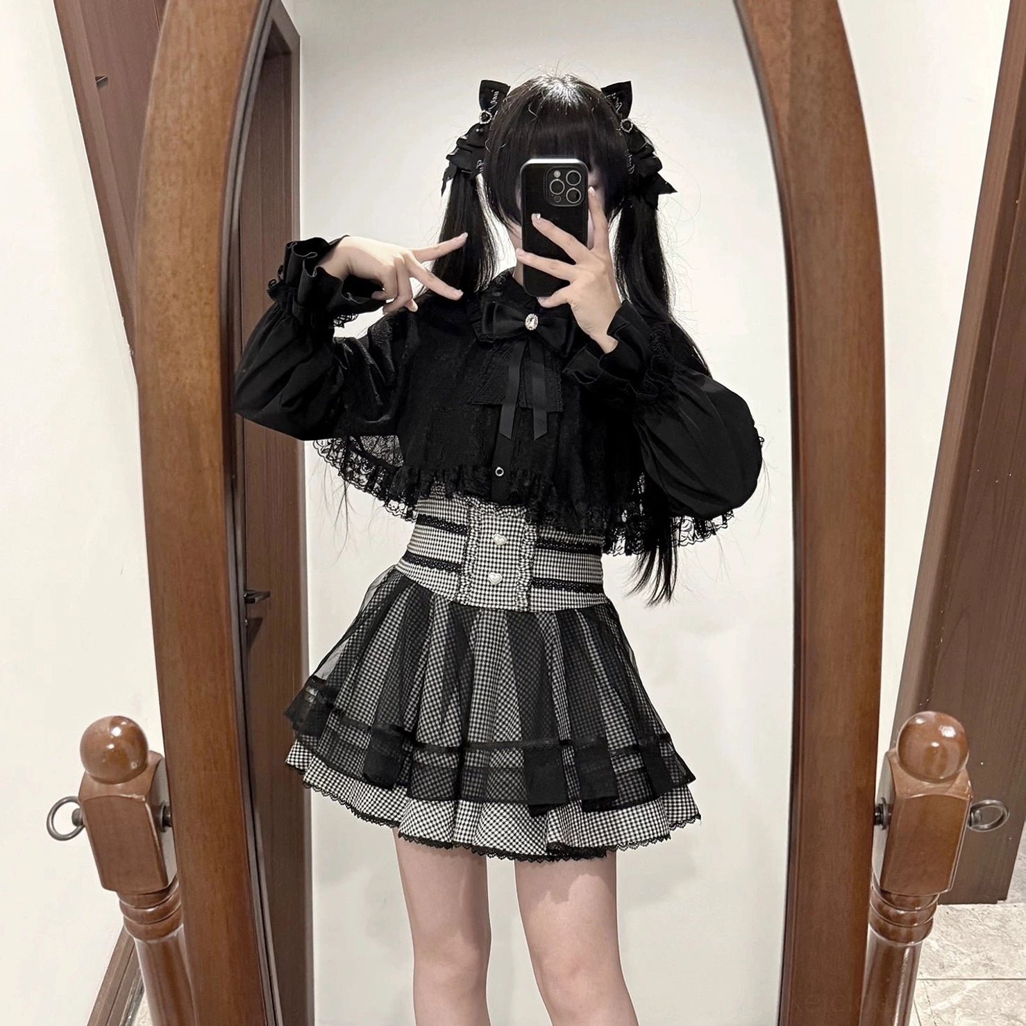 Black Jirai Kei lace blouse with detachable bow collar, shawl lace paneling, and flared cuffs, product detail photography