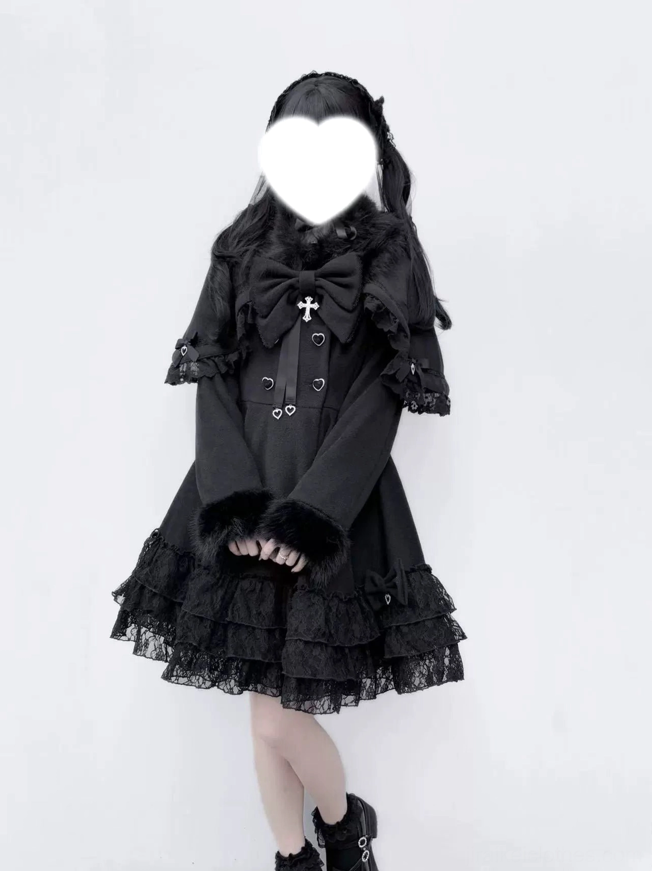 Jirai Kei black lace cape coat front view with A-line silhouette, ruffled lace hem, and cross bow brooch embellishment