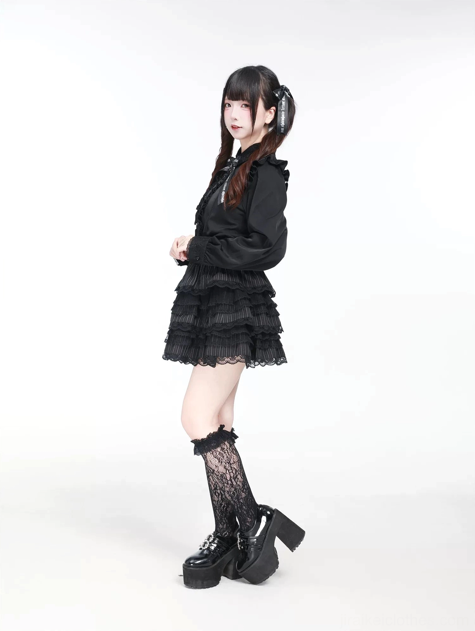 Jirai Kei black blouse side profile view displaying layered ruffle mini skirt coordination and gothic aesthetic styling