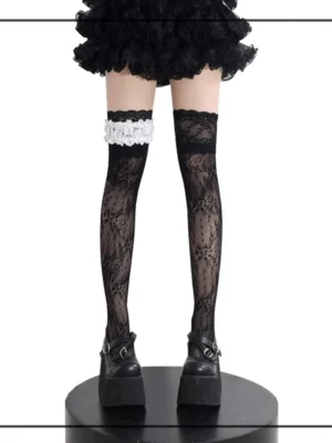 Black floral lace Jirai Kei thigh-high stockings with ruffled garter front view, paired with black platform Mary Jane shoes and ruffled skirt
