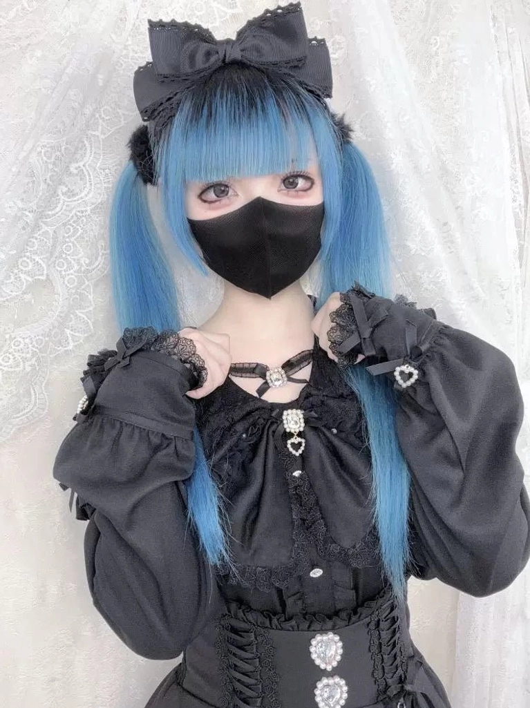 Black gothic Jirai Kei blouse with puff sleeves heart brooch and bow choker detail