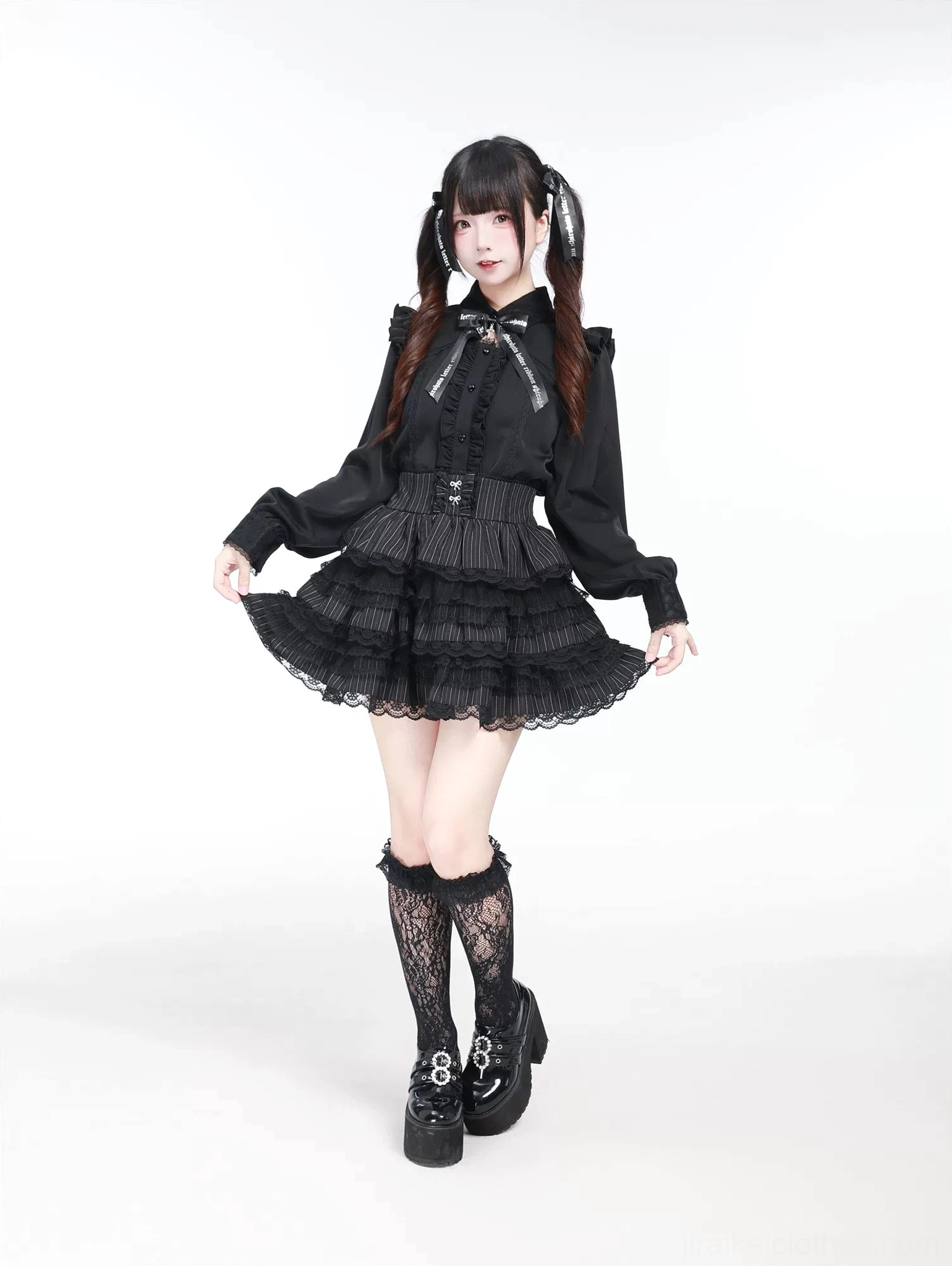 Black Jirai Kei long sleeve blouse side front angle showcasing fitted waist and lace-trimmed cuff details on model