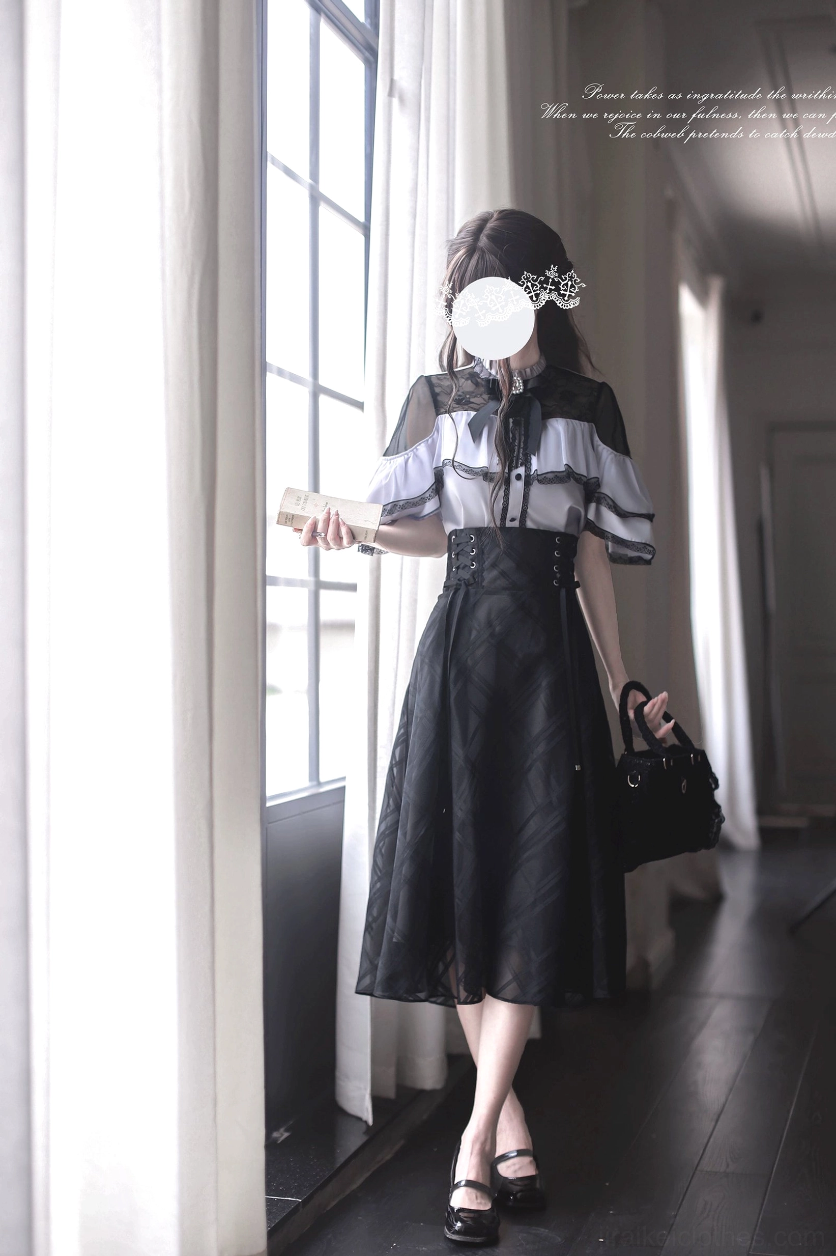 Jirai Kei outfit set three-quarter front view holding small book with black leather flats, bright windowed indoor room showcasing cape blouse design details
