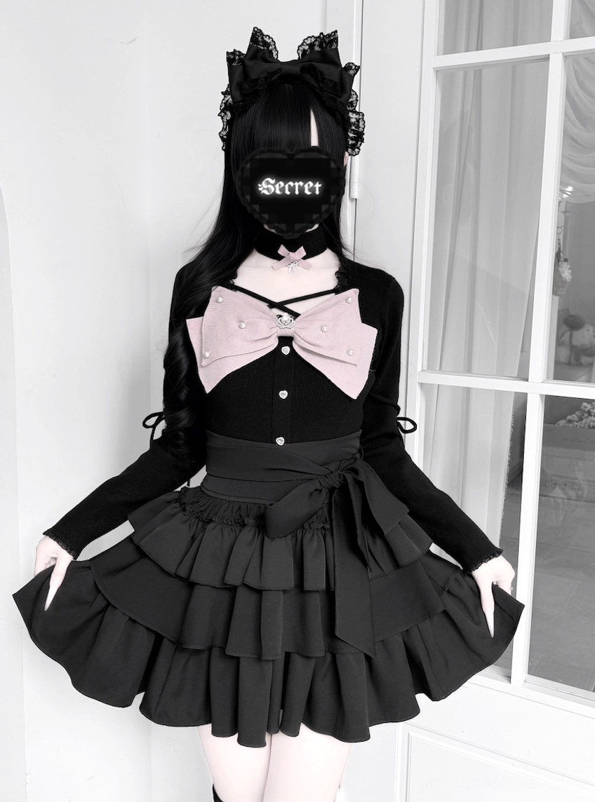 Black Jirai Kei outfit on model full front view featuring cat ear hairwear secret face mask and black layered ruffle skirt