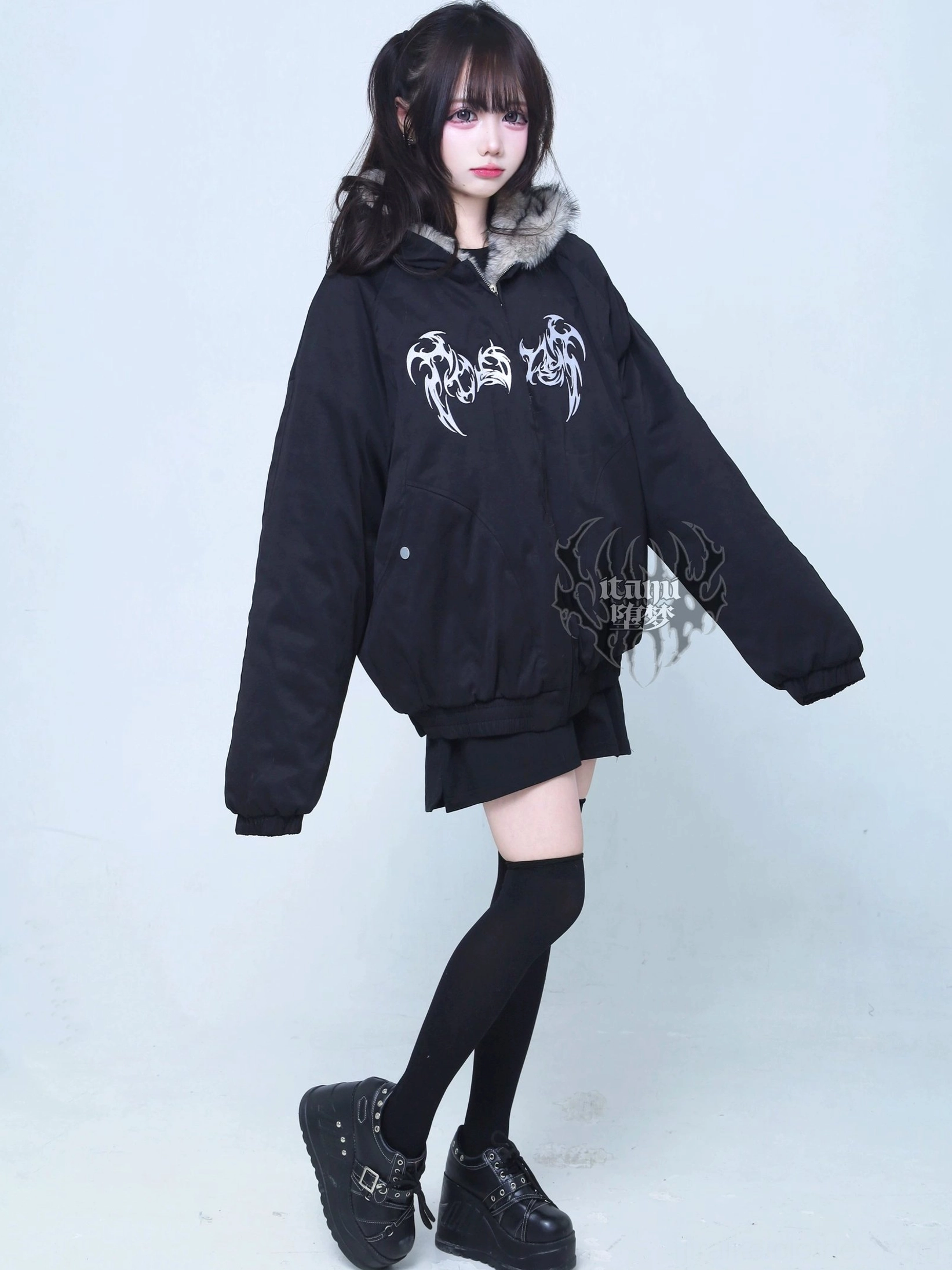 Jirai Kei black padded jacket left side profile view model posing oversized silhouette removable fur trim hood platform shoes goth fashion