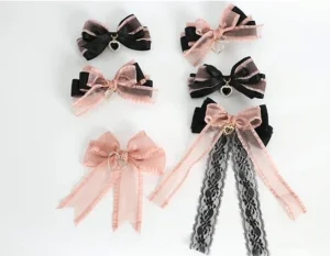 Assorted Jirai Kei black pink bow hair clips flat lay comparison solid pink bows lace ribbon variations