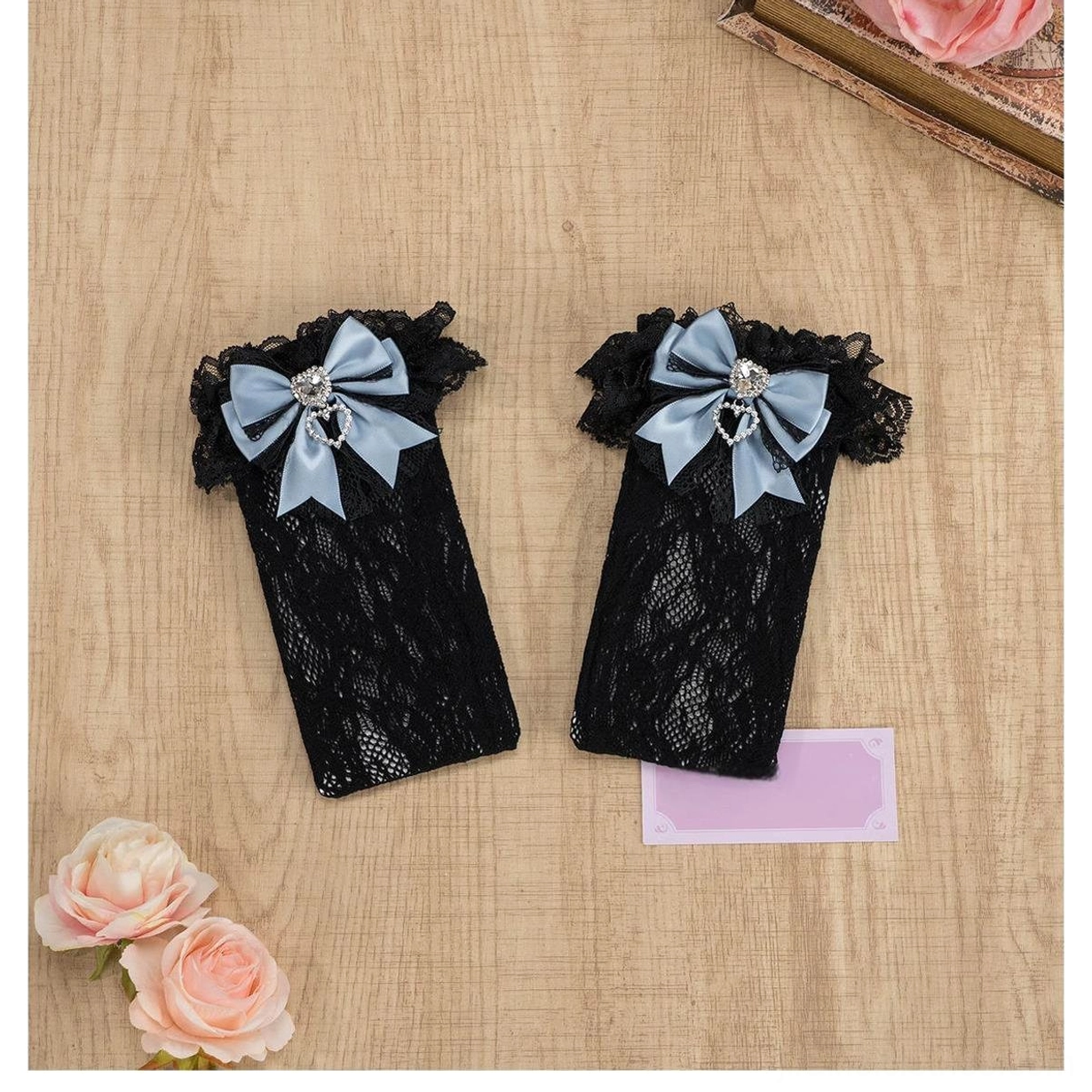 Black-pink lace knee-high Jirai Kei socks with ruffled cuff, pink decorative bow and heart rhinestone, full length front display