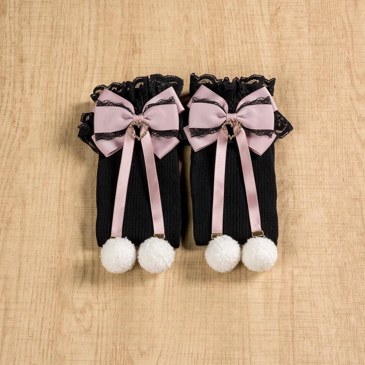 Jirai Kei black-pink mid-calf socks front full view showing contrast colorway with lace cuff pink bow white pom-pom pendant accent detail