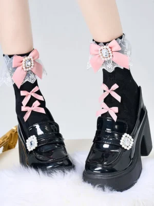 Black ankle socks with pink rhinestone bow and lace trim worn with platform loafers, showcasing Jirai Kei aesthetic and detailed embellishments