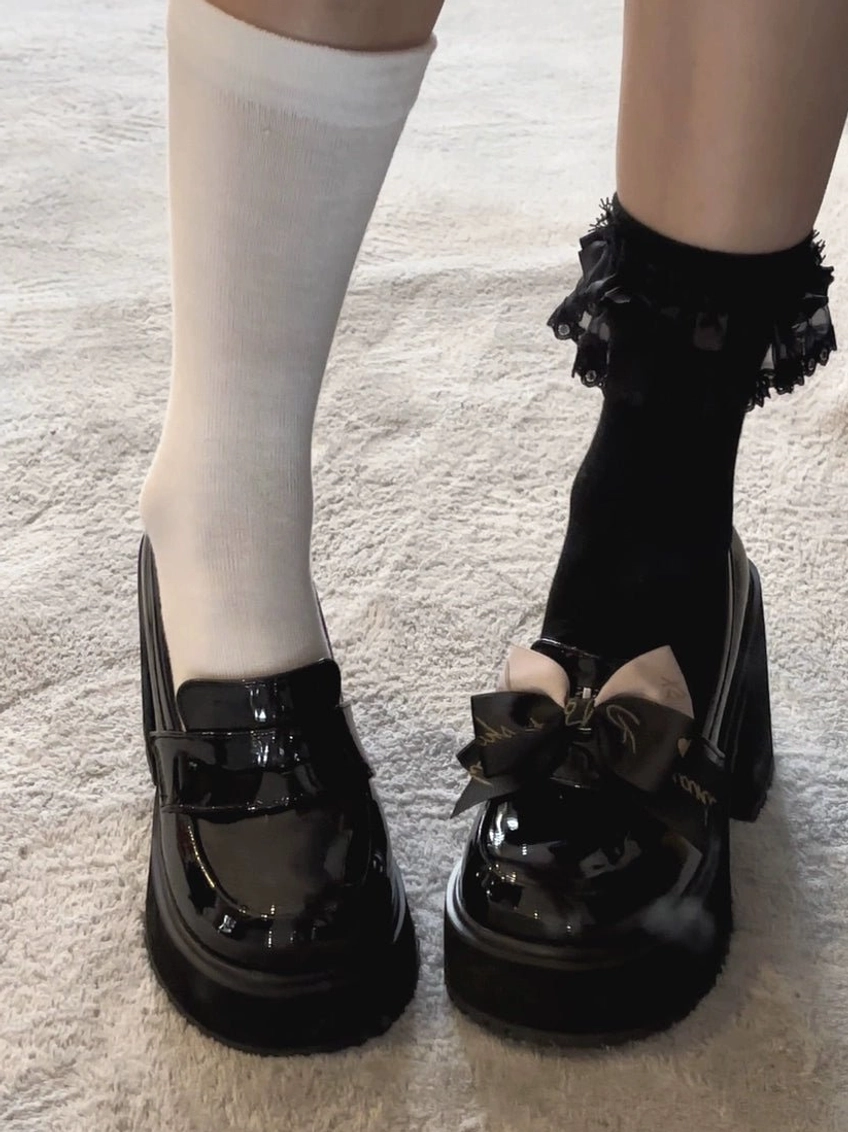 Jirai Kei black glossy platform heels bottom sole view showing thick platform construction and heel architecture for optimal support