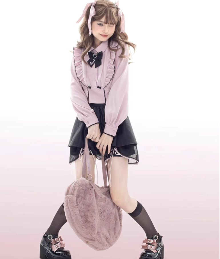 Full body shot of female lolita model wearing black platform shoes with pink bow accents, paired with pink plush handbag and coordinated sweet outfit