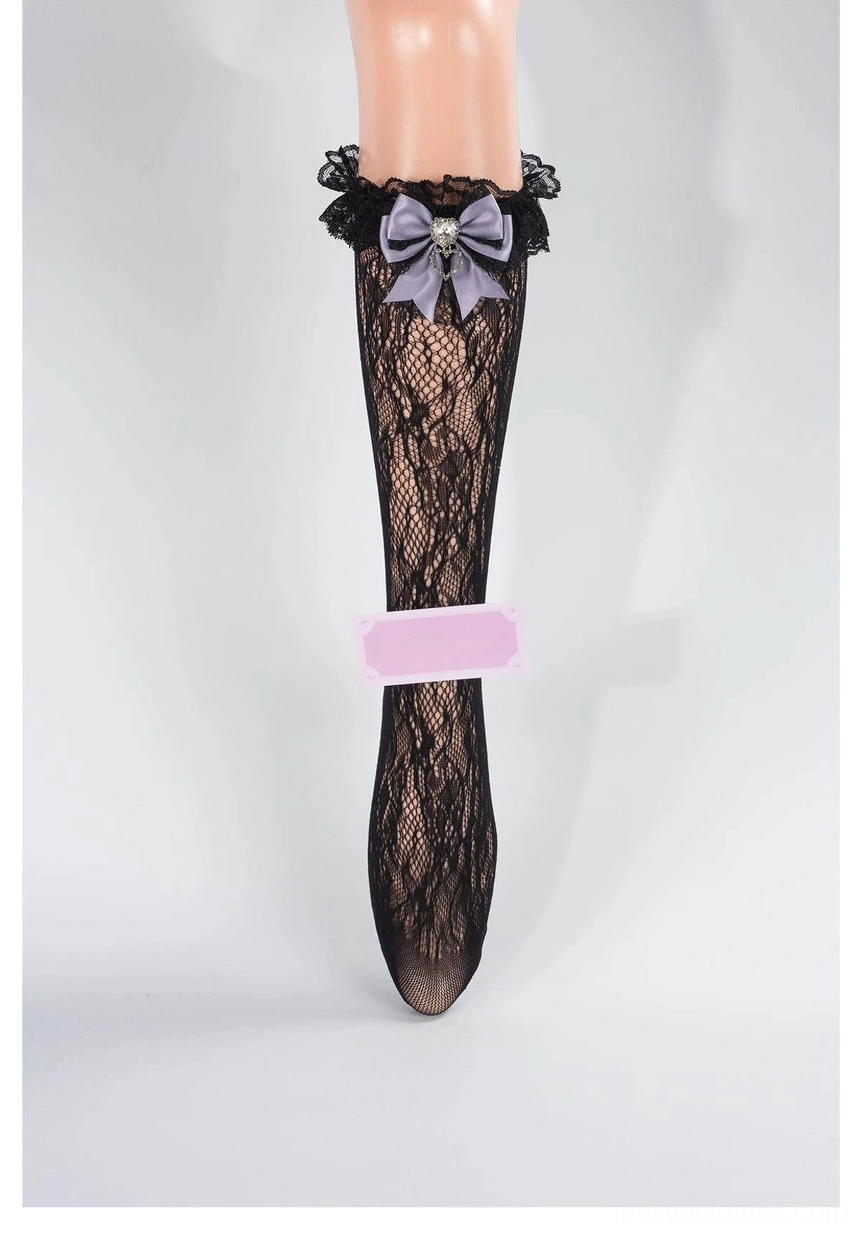 Black floral lace mid-calf Jirai Kei socks with purple bow and heart rhinestone embellishment, ruffled black lace cuff, front full view