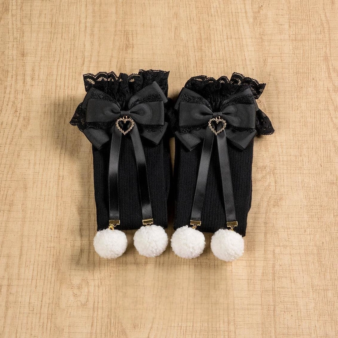 Jirai Kei black knee-high and mid-calf socks size comparison showing both lengths available in classic black colorway with lace cuffs and pom-pom accents