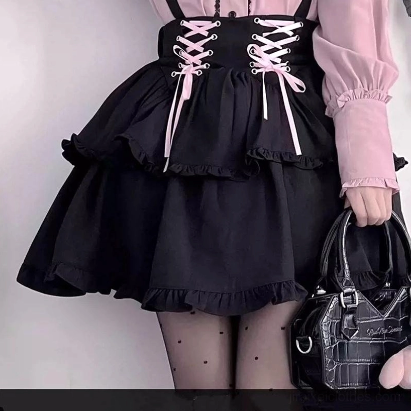 Alternative Jirai Kei coordinate variation showing black suspender skirt styling option paired with coordinating accessories and gothic room decor background
