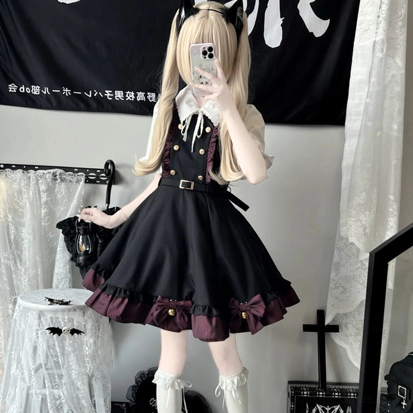 Jirai Kei black suspender skirt worn styling demonstration showing how vintage buttons and striped trim create dimensional aesthetic with movement