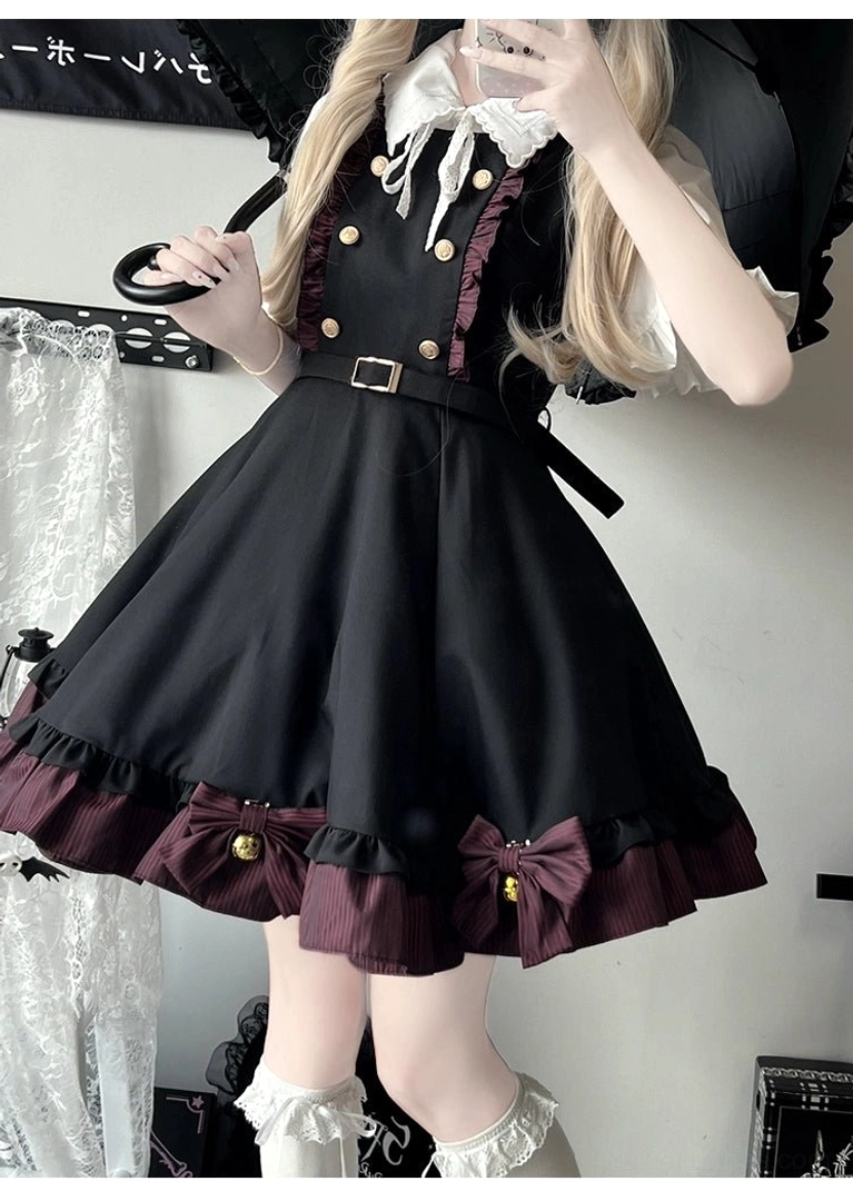 Black suspender skirt Jirai Kei component with complete vintage button ornaments and striped ruffle hem detail shot