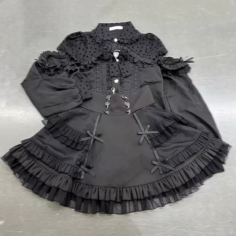 Black Jirai Kei tiered ruffled skirt flat lay showing lantern sleeves ruffled lace details multi-layer ruffled hem construction