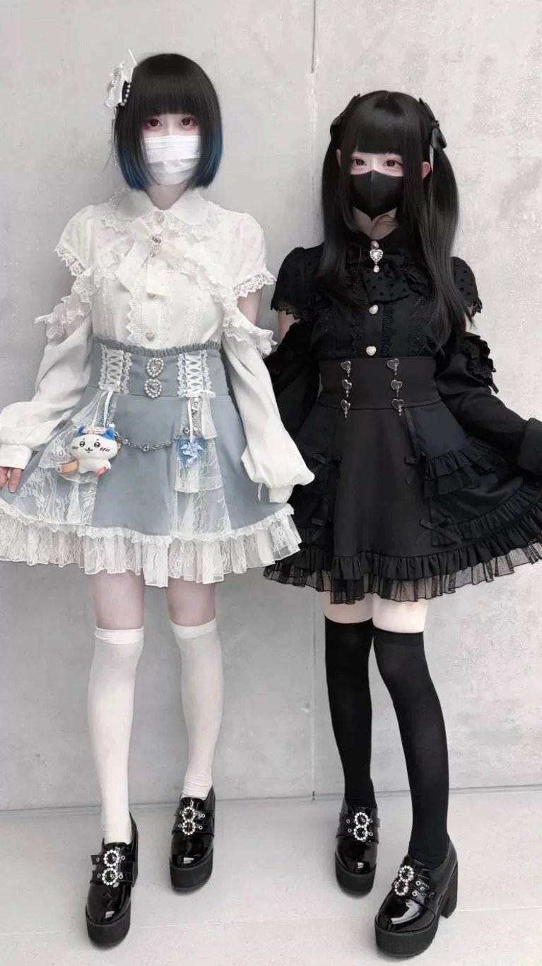 Black Jirai Kei tiered skirt full outfit with thigh-high socks platform loafers cinched waist two models alternative fashion