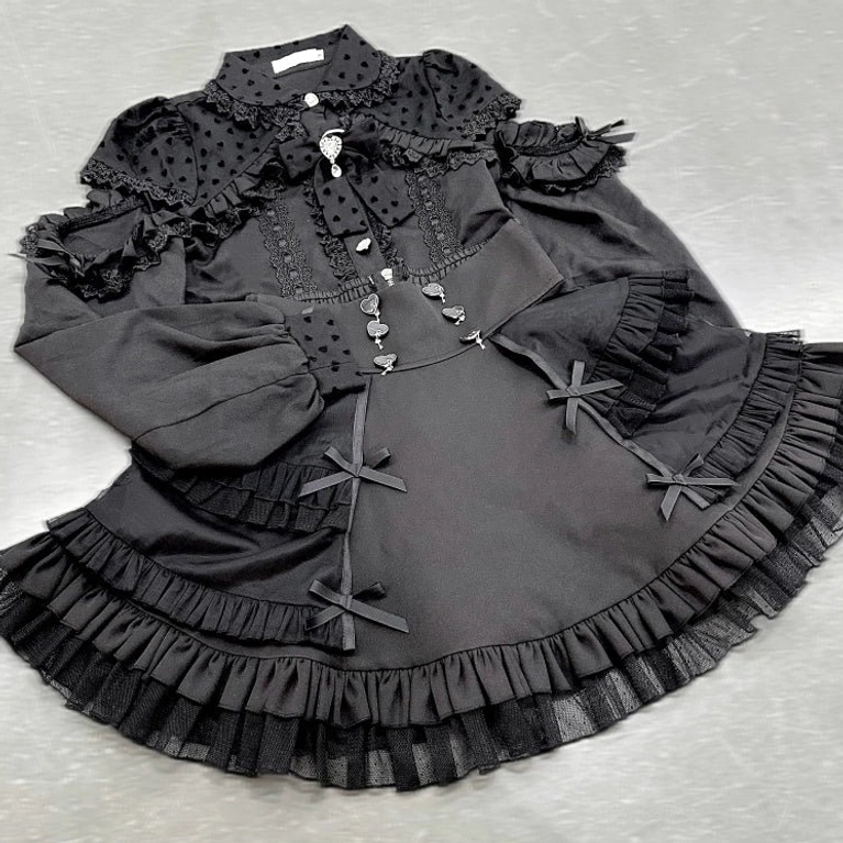 Black Jirai Kei tiered skirt side front flat lay view side ruffled hem detailed metal fasteners bow accents construction details