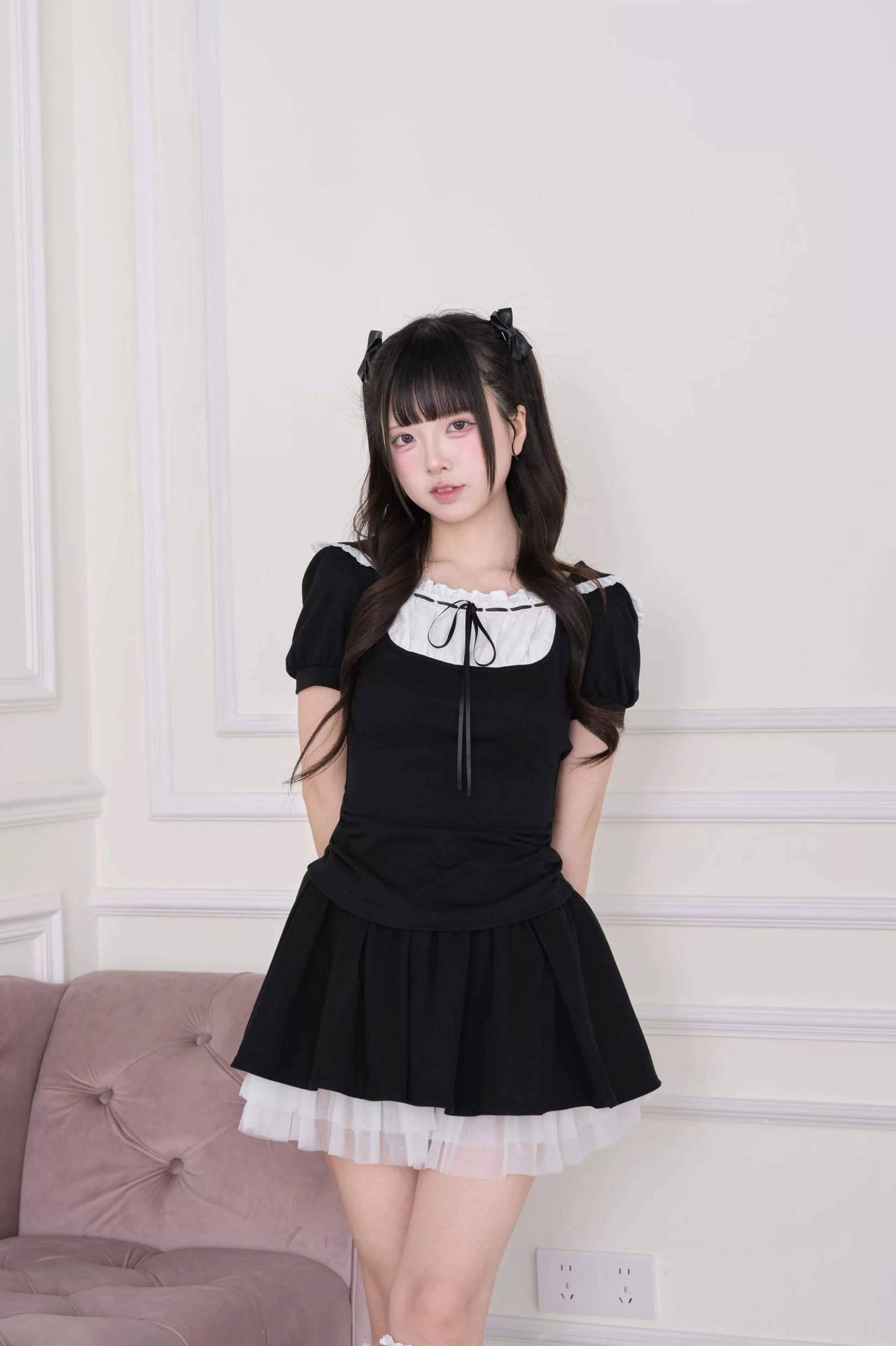Black Jirai Kei hoodie tulle skirt close-up full body view indoors showing square ruffled collar with front bow and lace ankle socks