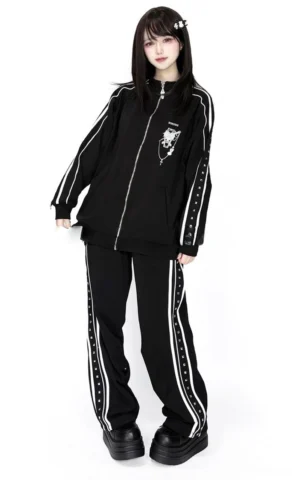 Black velvet Jirai Kei tracksuit set with striped side trims and chest embroidery, full front view on female model with white background