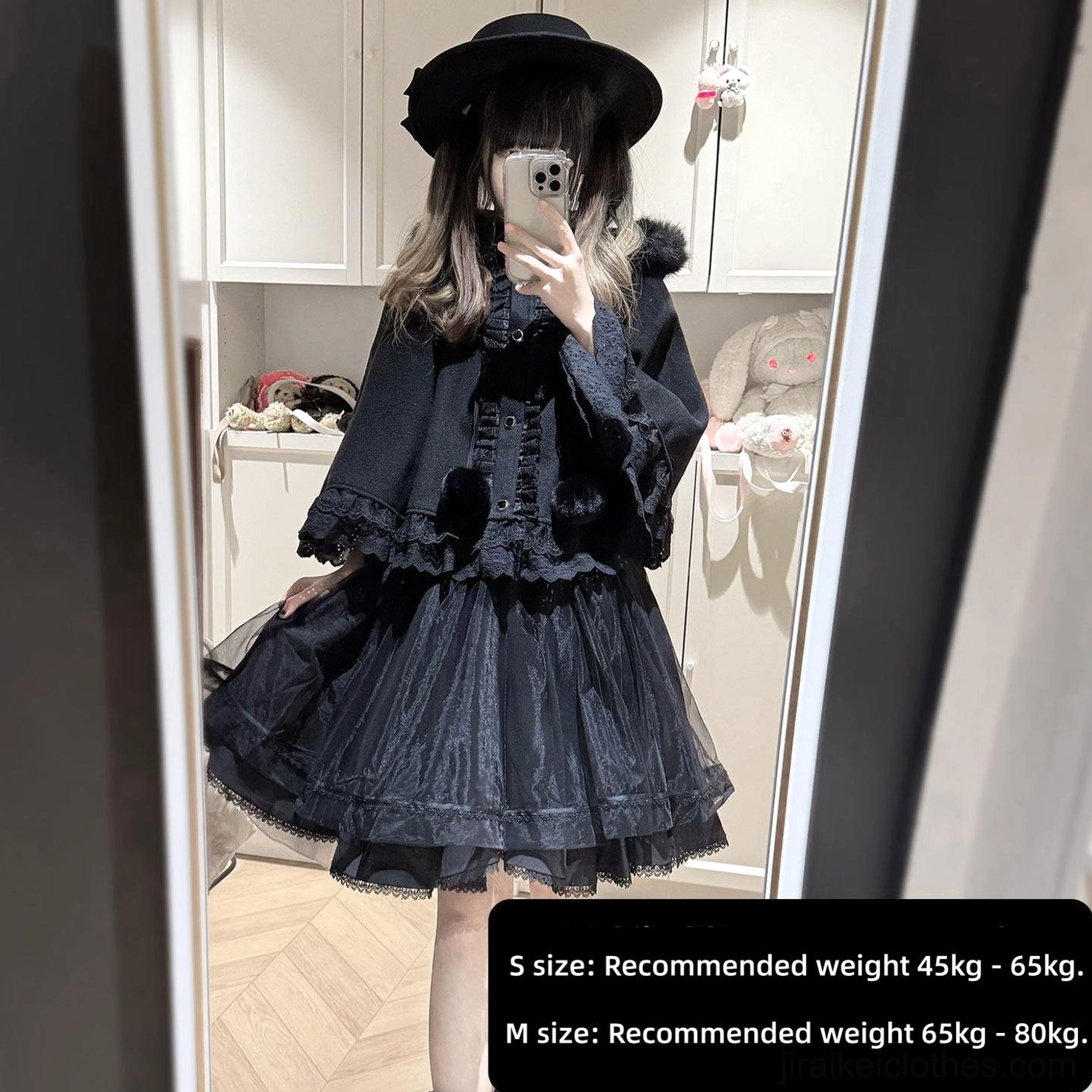 Black Jirai Kei winter cape with ruffled design and tiered tulle skirt, side angle mirror selfie with fuzzy black hat