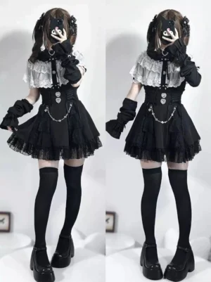 Black and white Jirai Kei blouse two-piece outfit with twin models in mirror selfie view showing short sleeves and ruffle details