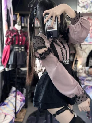 Side view of jirai kei blouse showing off-shoulder design with detachable collar bow and lace details on model