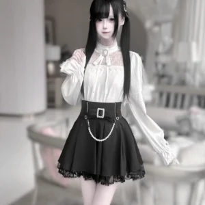 Jirai Kei white and black two-piece set three-quarter angle view high collar bow tie pearl waist chain lace trimmed hem