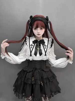 Jirai Kei cross pendant flutter sleeve blouse and black suspender skirt set front view twin-tail model gray backdrop