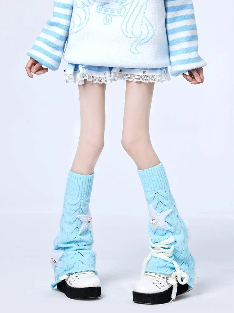 Full length lower body shot of sky blue Jirai Kei leg warmers styled with striped knit top and white lace mini skirt, showcasing hollow knit design and star embellishments against white studio background