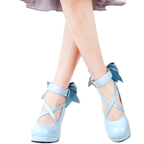 Jirai Kei light blue platform heels with cross ankle strap back bow decoration styled with light gray skirt model leg view