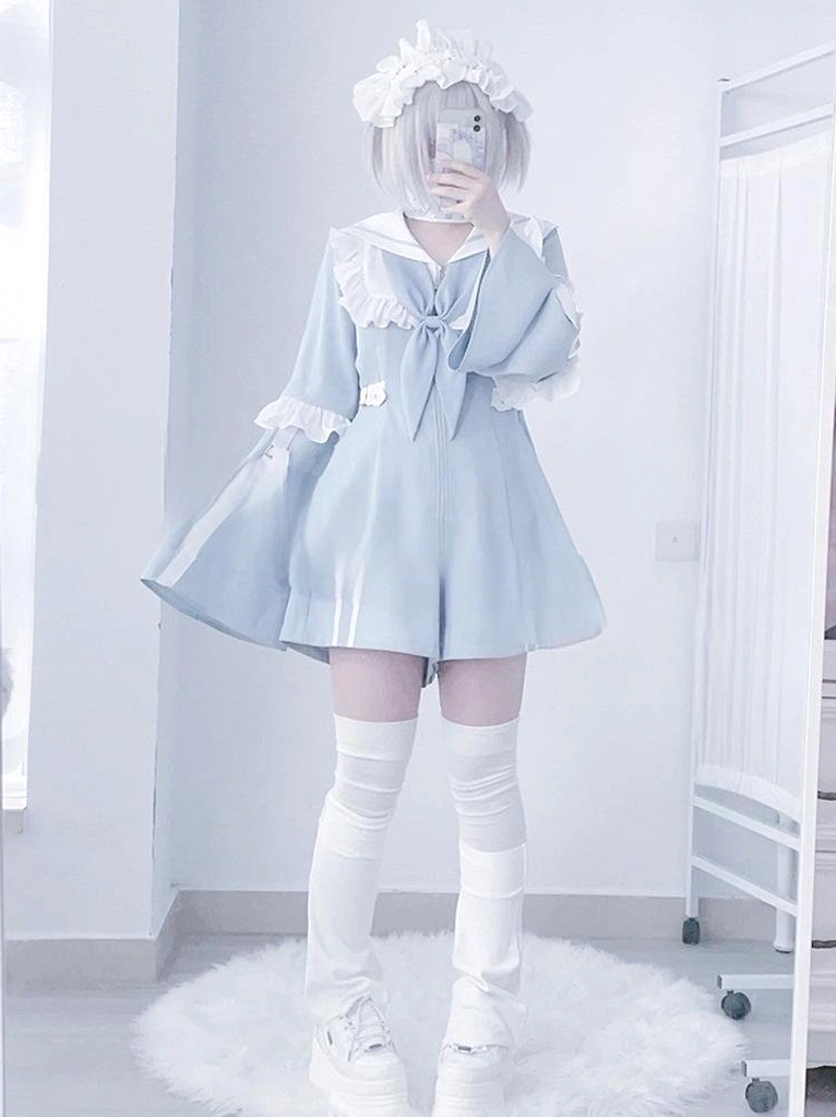Front mirror selfie of light blue sailor Jirai Kei two-piece set showcasing ruffled cuffs, front bow accent, matching shorts, and white platform shoes worn with frilly headpiece