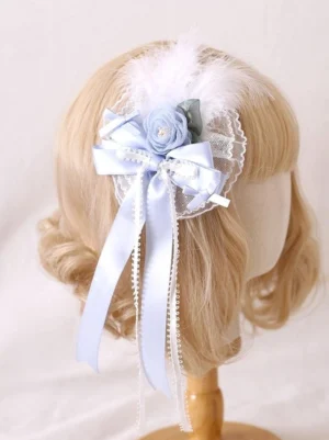 Blue lace Jirai Kei side hair clip with satin bow fabric rose and white feather on mannequin head side view detail