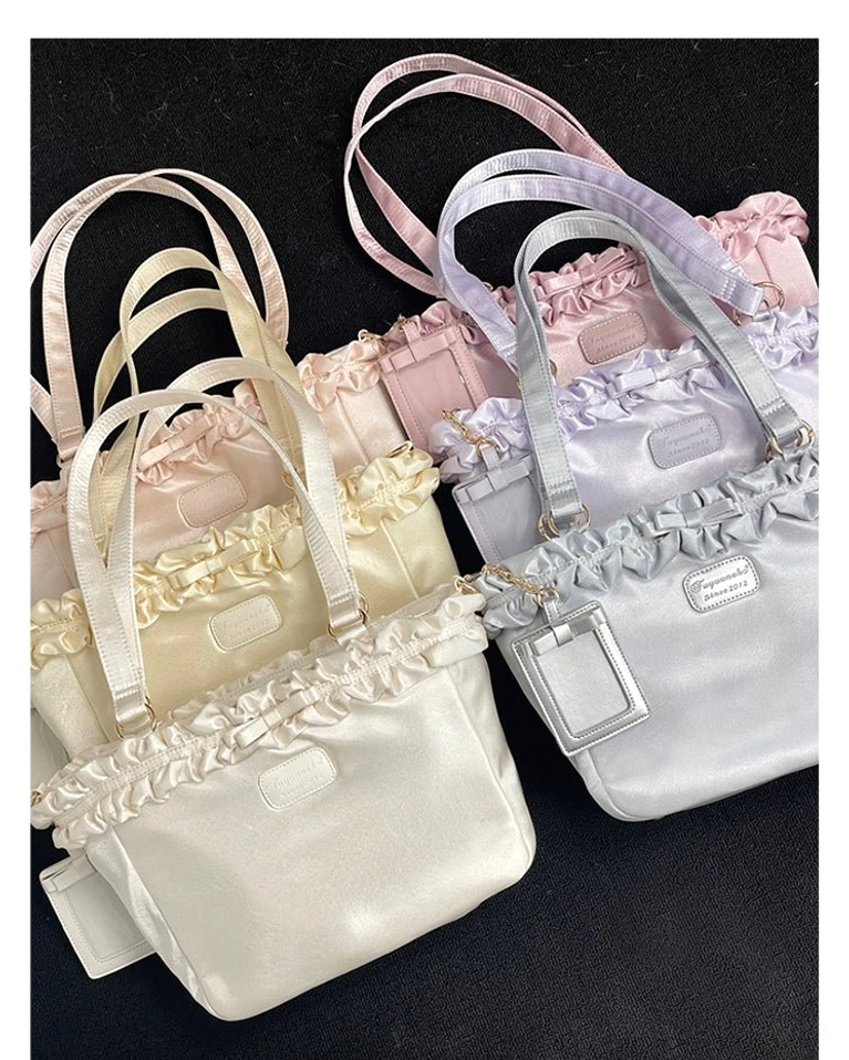 Solid color Jirai Kei bouquet itabag totes flat lay studio display showing smooth satin fabric and dual top carry handles