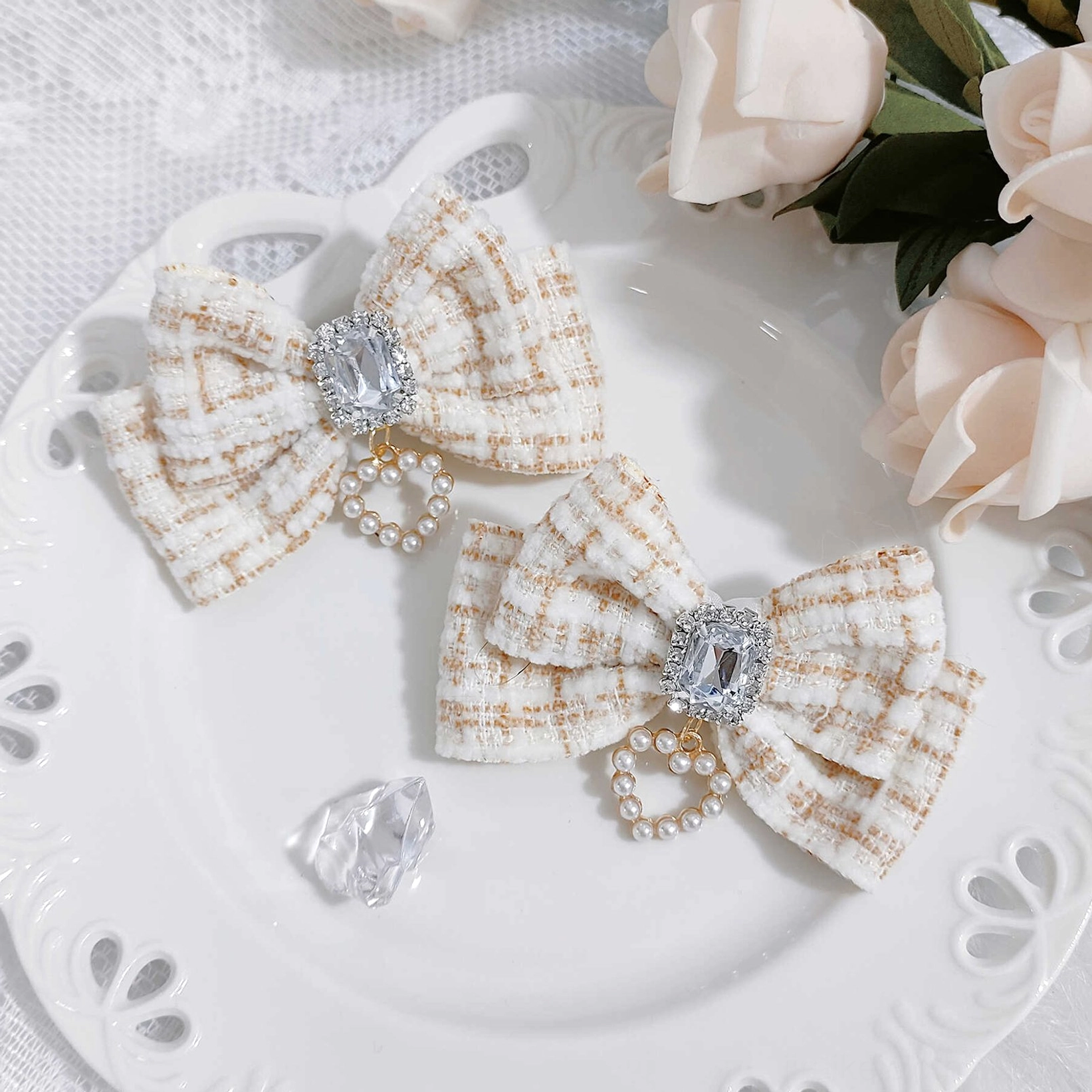 Elegant off-white beige plaid tweed Jirai Kei bow hair clips featuring vintage double-bow silhouette with rhinestone and pearl accent, romantic flat lay photography
