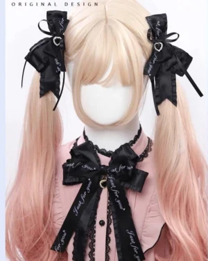 Jirai Kei lolita bow hair clips and brooch set styled on mannequin with twin tail hairstyle showcasing black satin bows with heart and gem charms