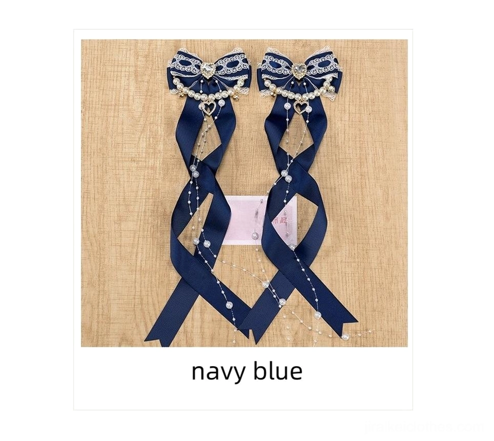 Jirai Kei bow hair clips with heart rhinestone and pearl chain close-up detail view showcasing lace trim and fabric texture