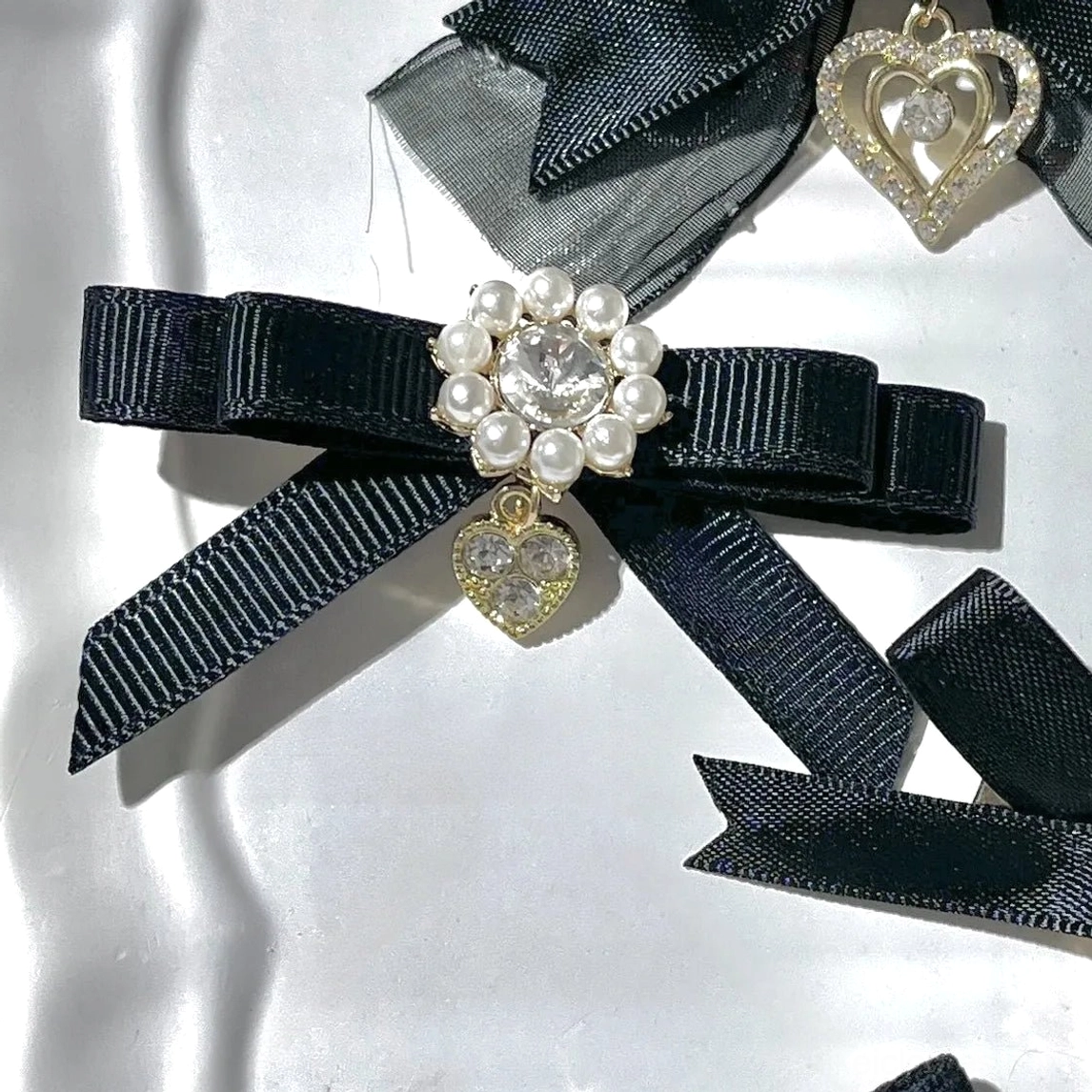 Jirai Kei bow pendant hair clips style featuring hanging pendant decoration with rhinestone and pearl accents multiple colors