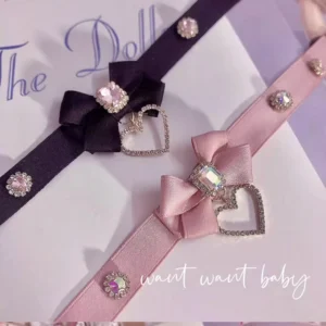 Handmade bow rhinestone choker necklace flat lay featuring delicate satin ribbon with sparkling cubic zirconia stones and heart-shaped pendant charm for Jirai Kei fashion aesthetic