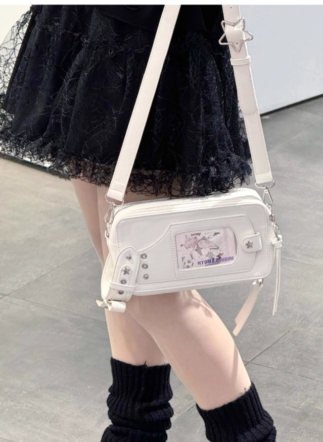 Jirai kei brick itabag crossbody bag worn on body low angle view with small anime print window display