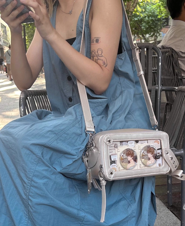 Jirai kei brick itabag transparent display window detail showing rivet decorations and star metal hardware close up