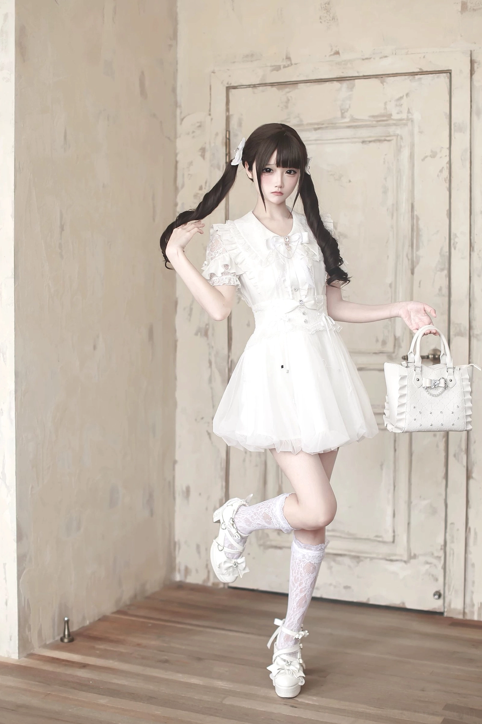 Jirai Kei bubble skirt lace-up side details and mini bow accents, architectural tulle silhouette high-waist construction detail shot