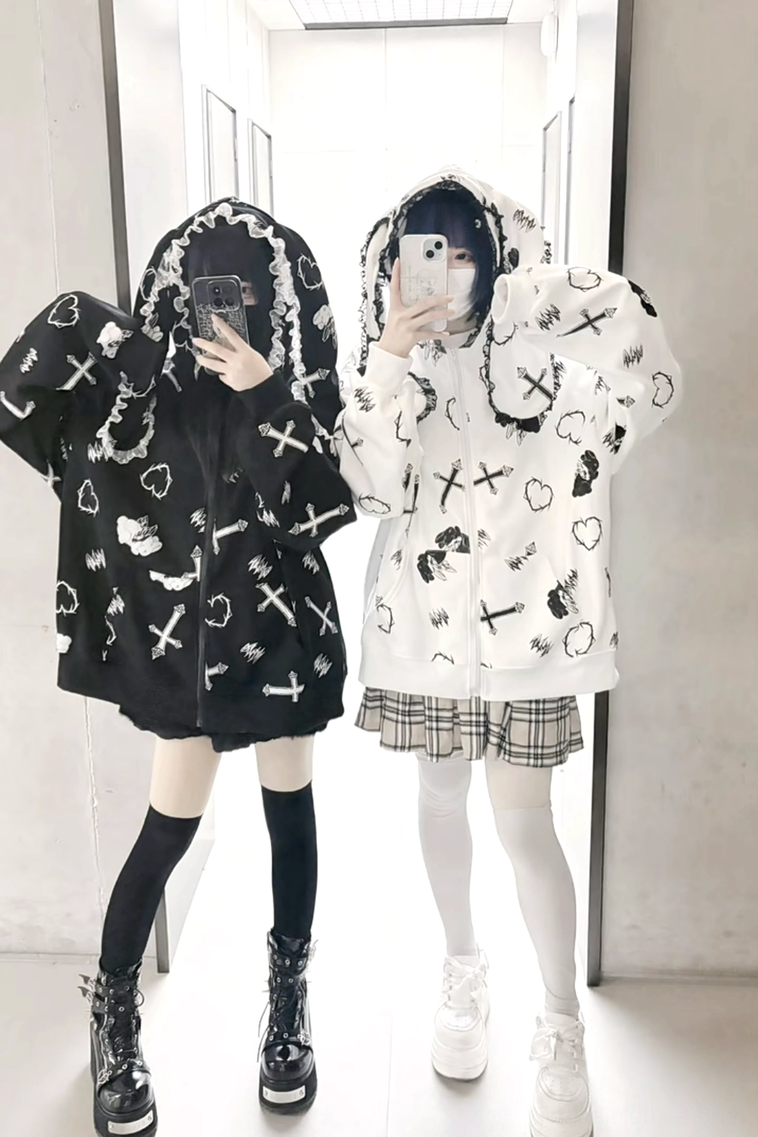 Back view of Jirai Kei bunny ear zip-up hoodie coat with cross and heart prints, featuring lace-trimmed hood design photographed on goth-style models