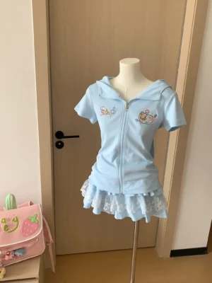 Blue Jirai Kei bunny ear zip hoodie and tiered lace skirt two-piece set front view on dress form with light blue fabric and delicate embroidery details
