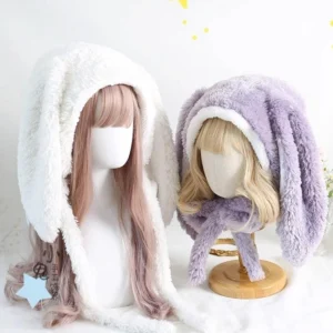 Jirai Kei plush bunny ear hooded hat with attached scarf in multiple color options displayed on mannequin heads showing off-white and mallow purple variations front view